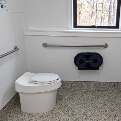 Indoor restroom with waterless toilet